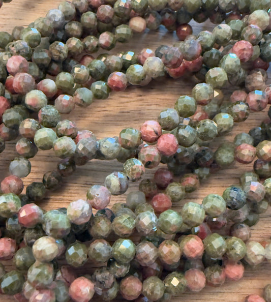 Unkite Bracelets Multi Faceted Beads assorted natural unakite colors green, and pink mottled appearance 