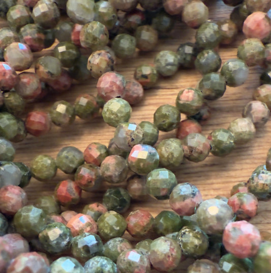 Unkite Bracelets Multi Faceted Beads assorted natural unakite colors green, and pink mottled appearance 