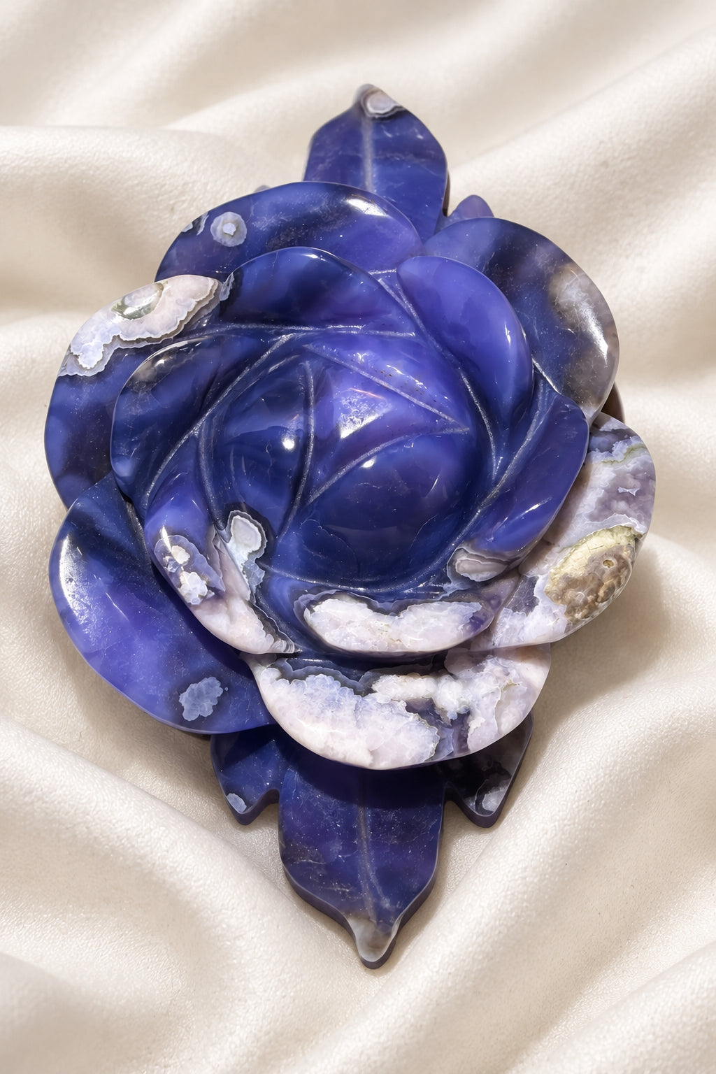 blue flower agate carved rose. deep and light blue colors, white flower pattern consistent with genuine flower agate material