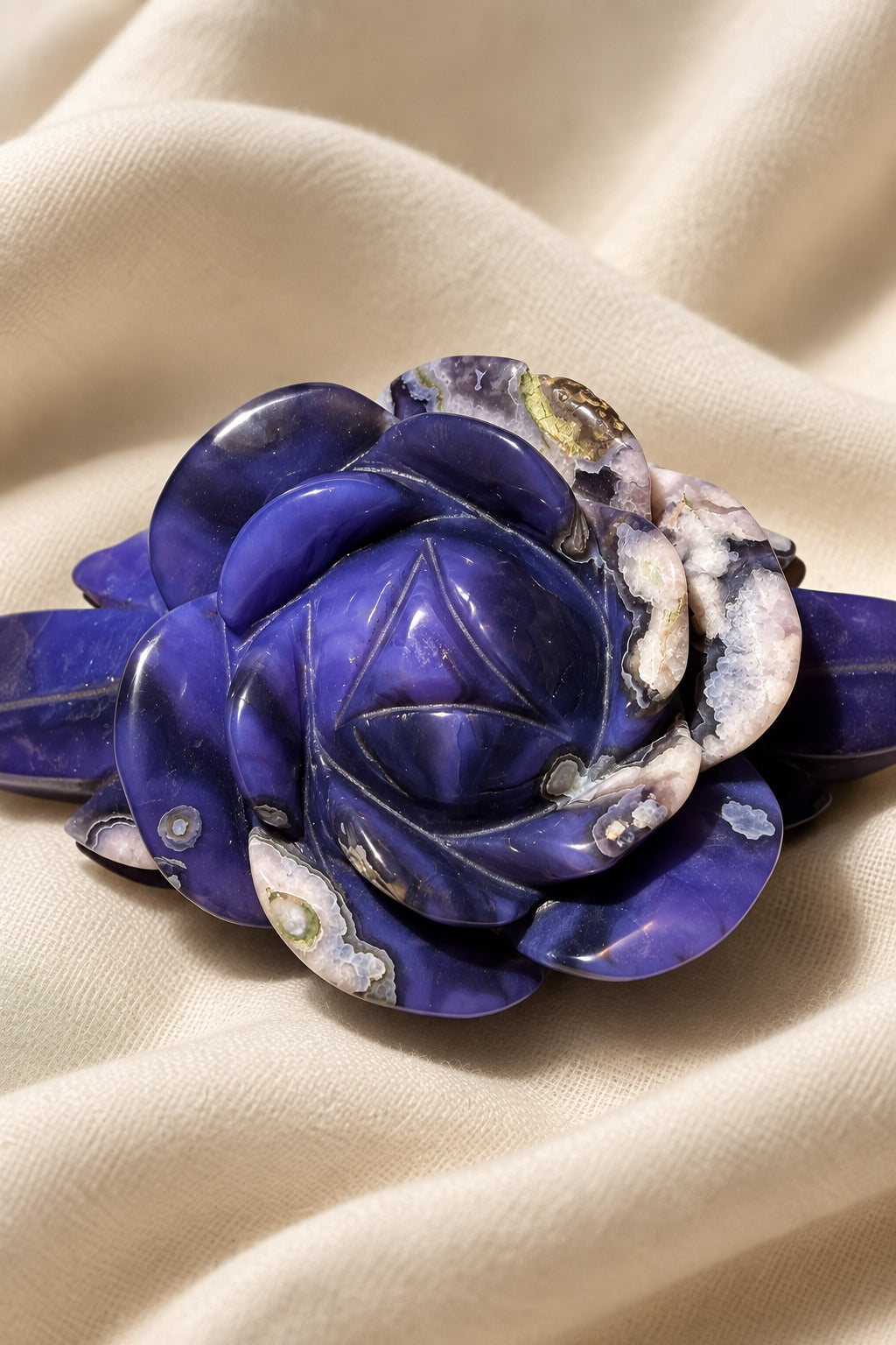 Rose figurine carved from deep blue flower agate white flower patterns throughout the carving consistent with genuine blue agate
