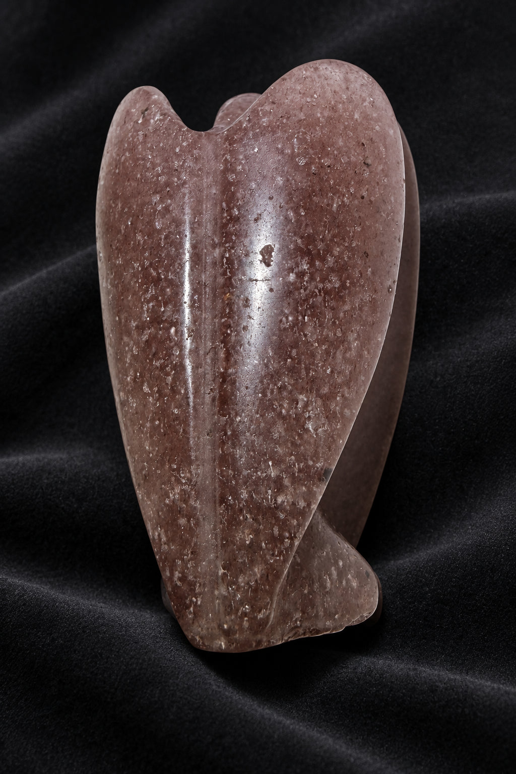 photo of the back angel carved from strawberry quartz crystal