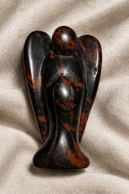 angel carved from mahogany obsidian beautiful black and deep copper colors throughout 