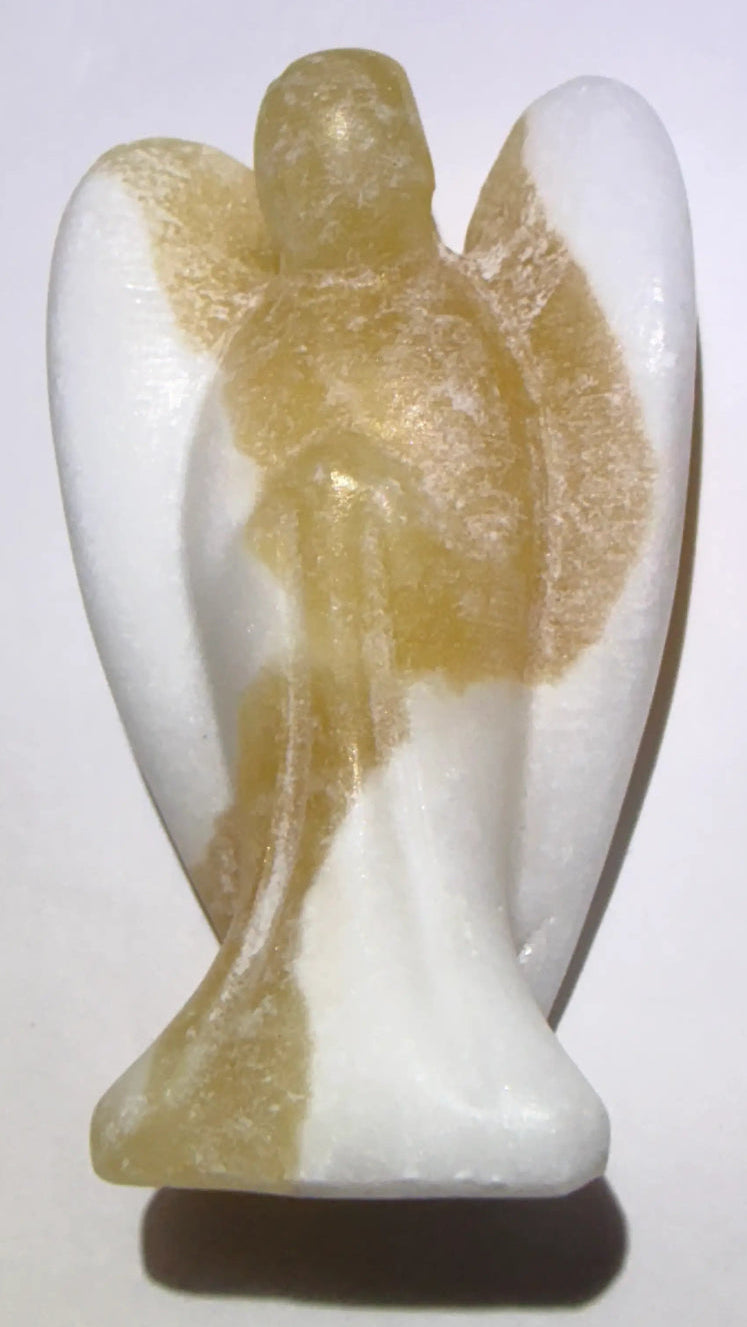 A small carved angel figurine made yellow calcite stone, standing on a plain light background.