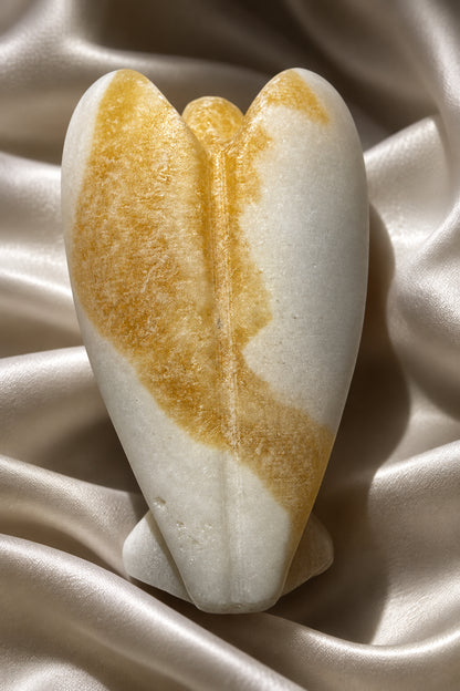Calcite angel figurine - hand carved. Streaks of yellow and white