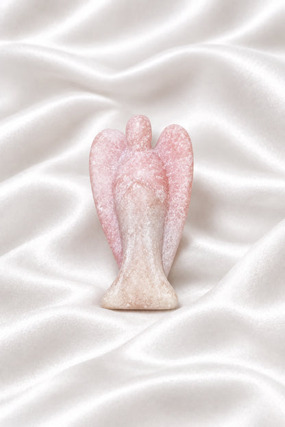 side view pink calcite hand carved angel