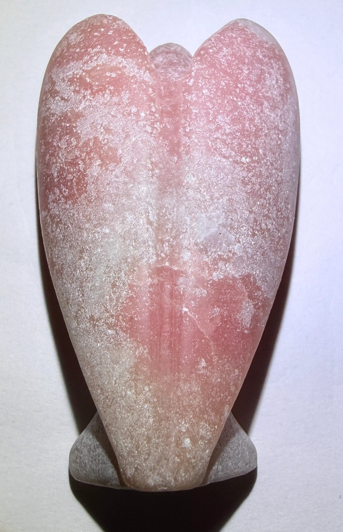 back side pink calcite carved angel showing wings