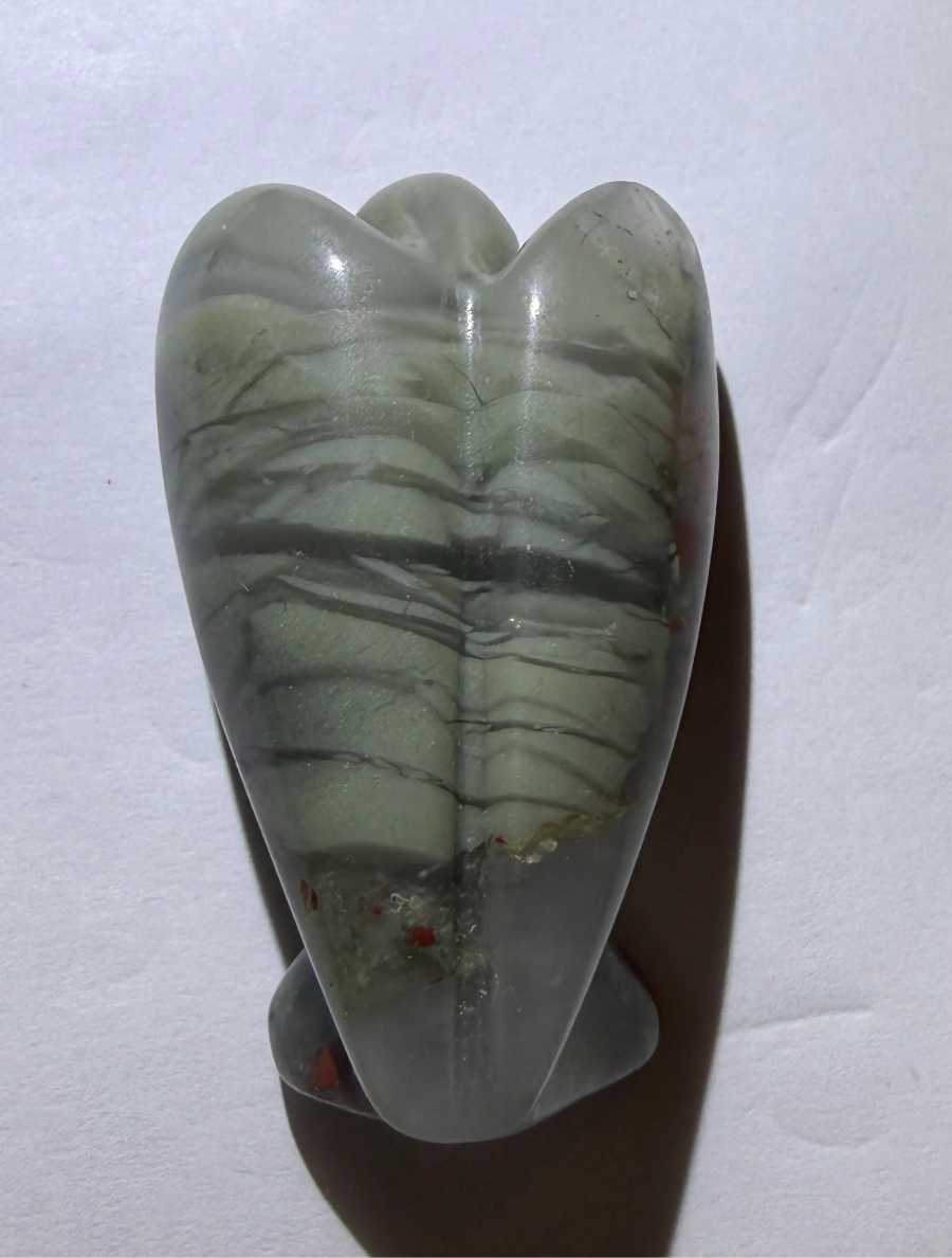 back side of angel carved from bloodstone crystal