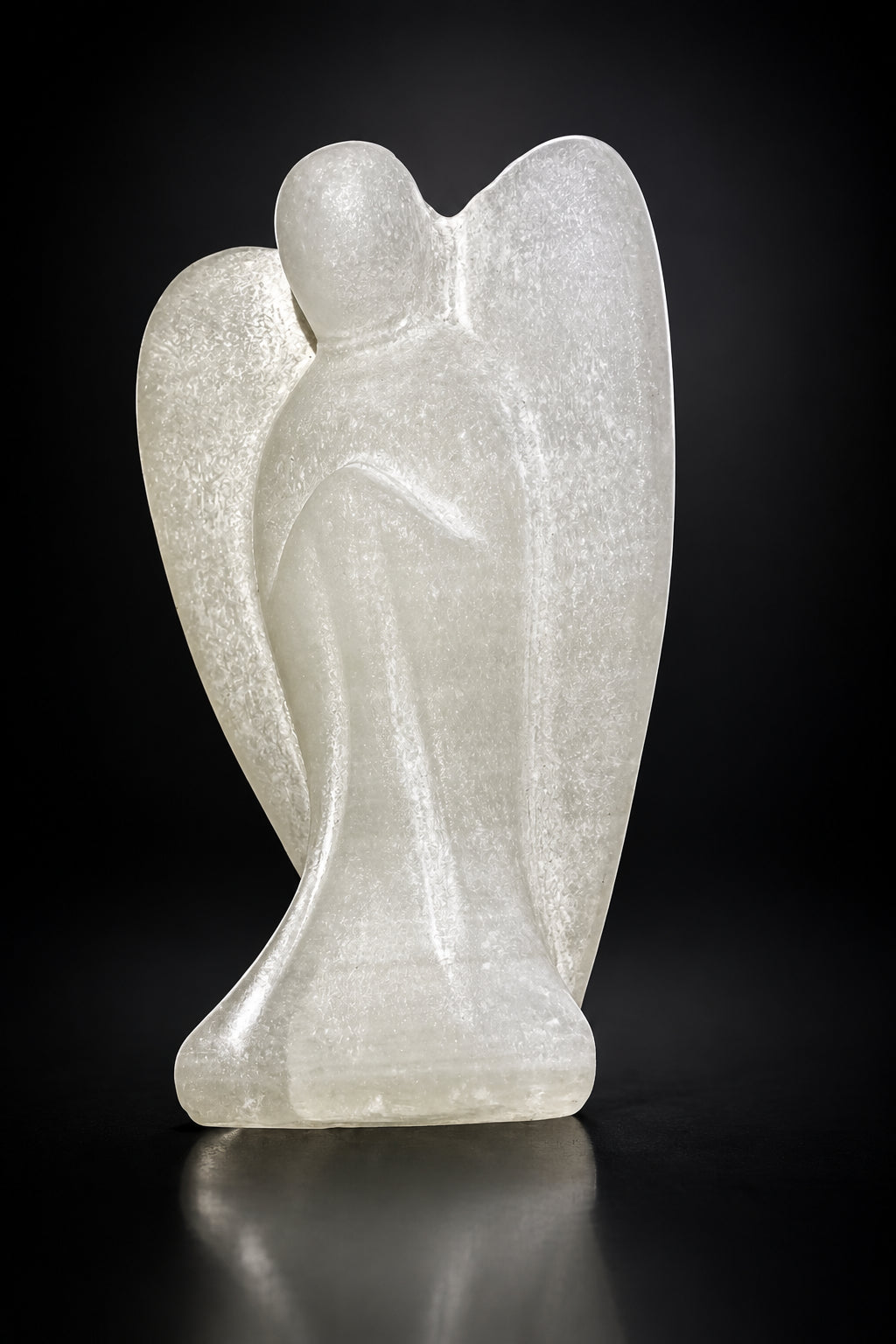 side view of satin spar angel. hand carved with wings