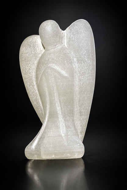 side view of satin spar angel. hand carved with wings