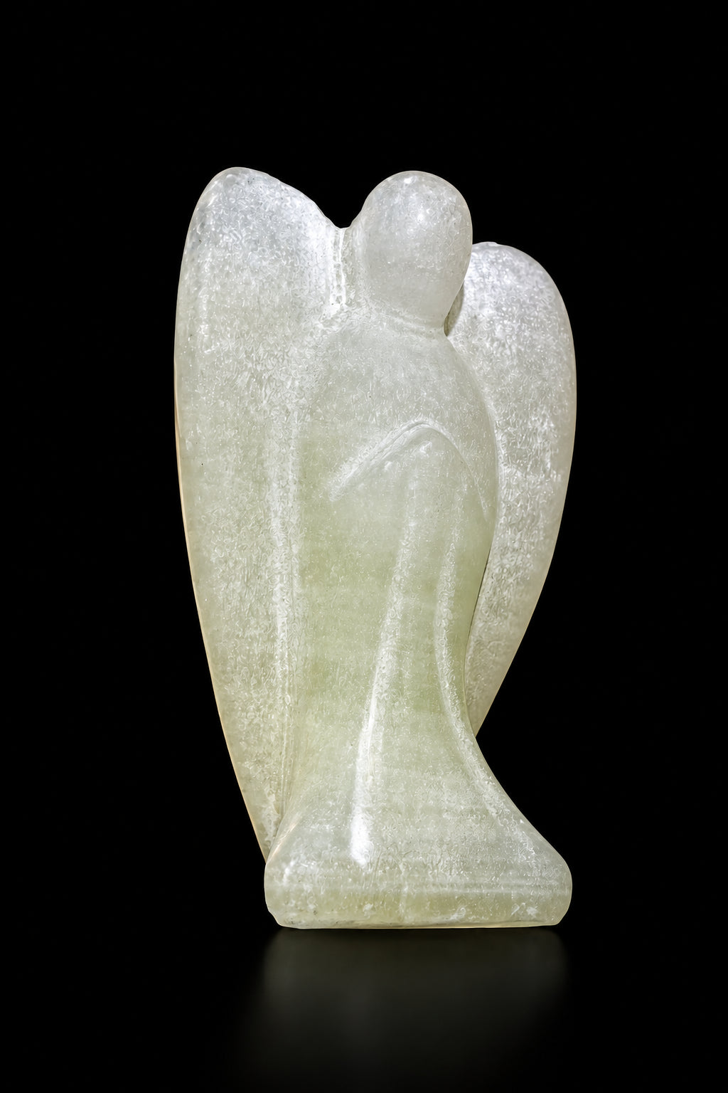 A small angel figurine carved from satin spar, sometimes called selenite
