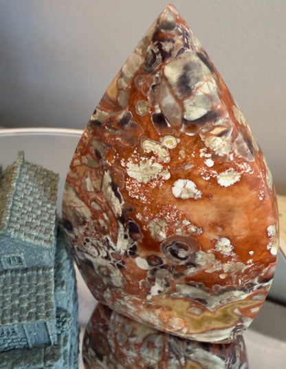 Money Agate teardrop freeform crystal showing intricate red cascade patterns for emotional balance and prosperity