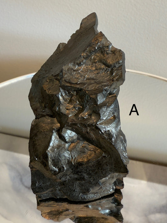 Natural shungite crystal healing stone for EMF protection, grounding, and energy balance