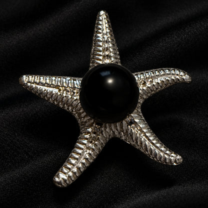 black agate mini sphere in a starfish display stand 