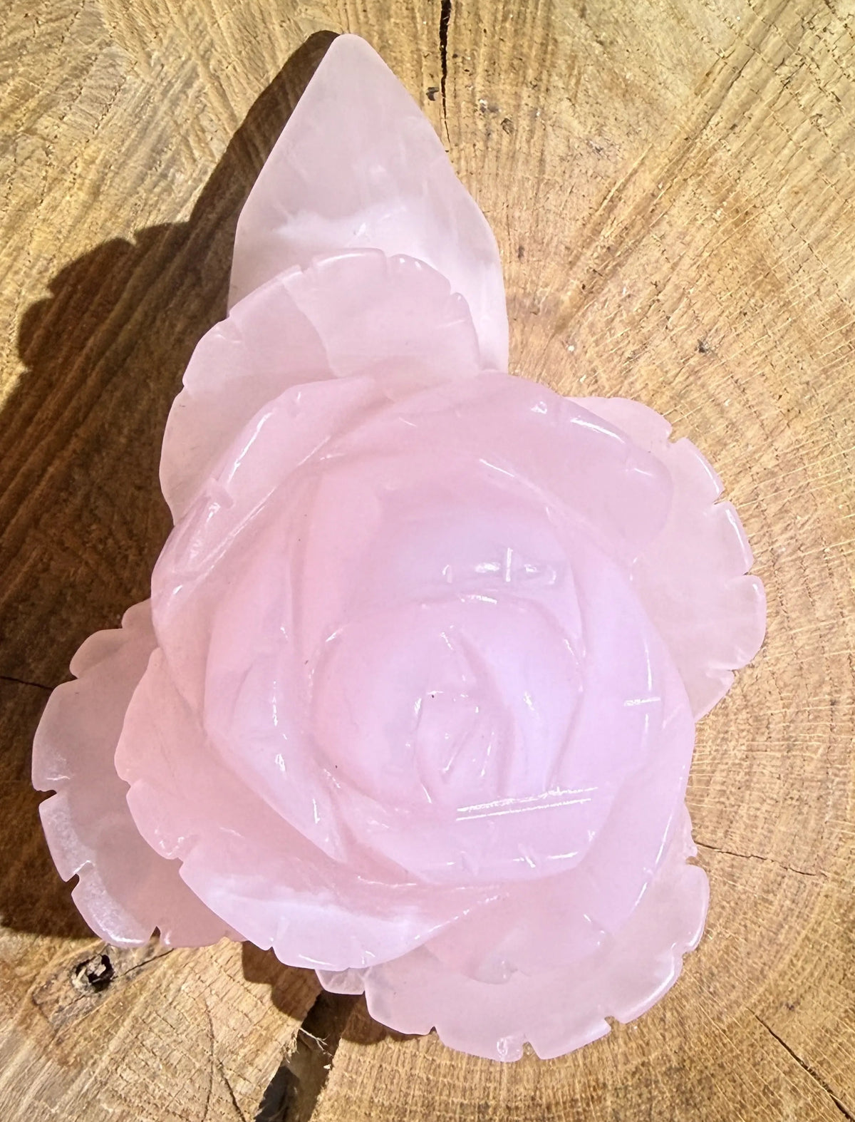 A carved pink rose quartz crystal 