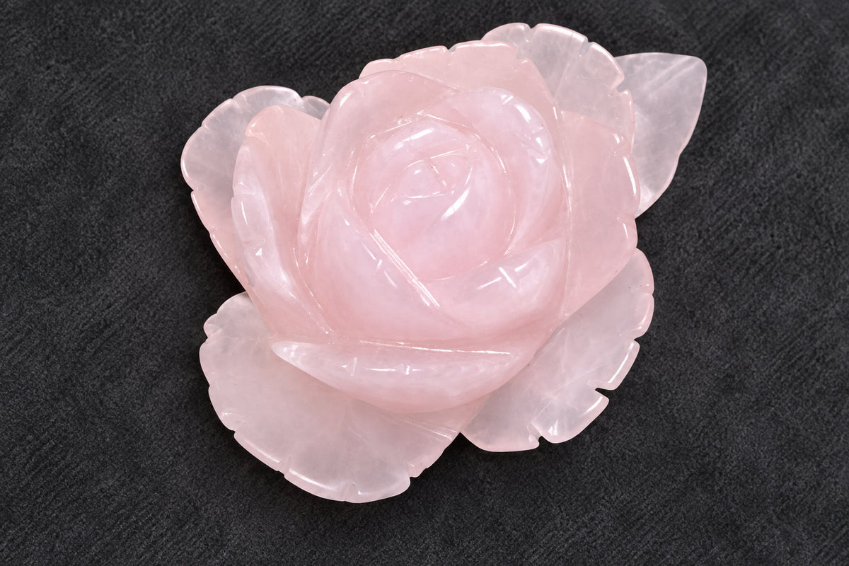 Hand carved rose quartz crystal to resemble a beautiful rose