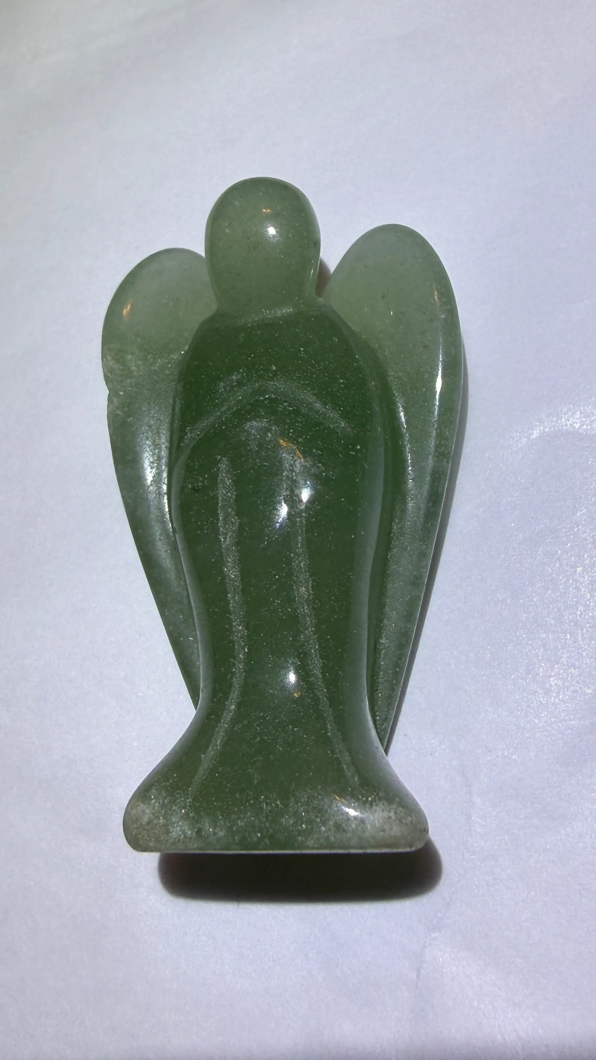 photo side view of green aventurine crystal carved angel with wings