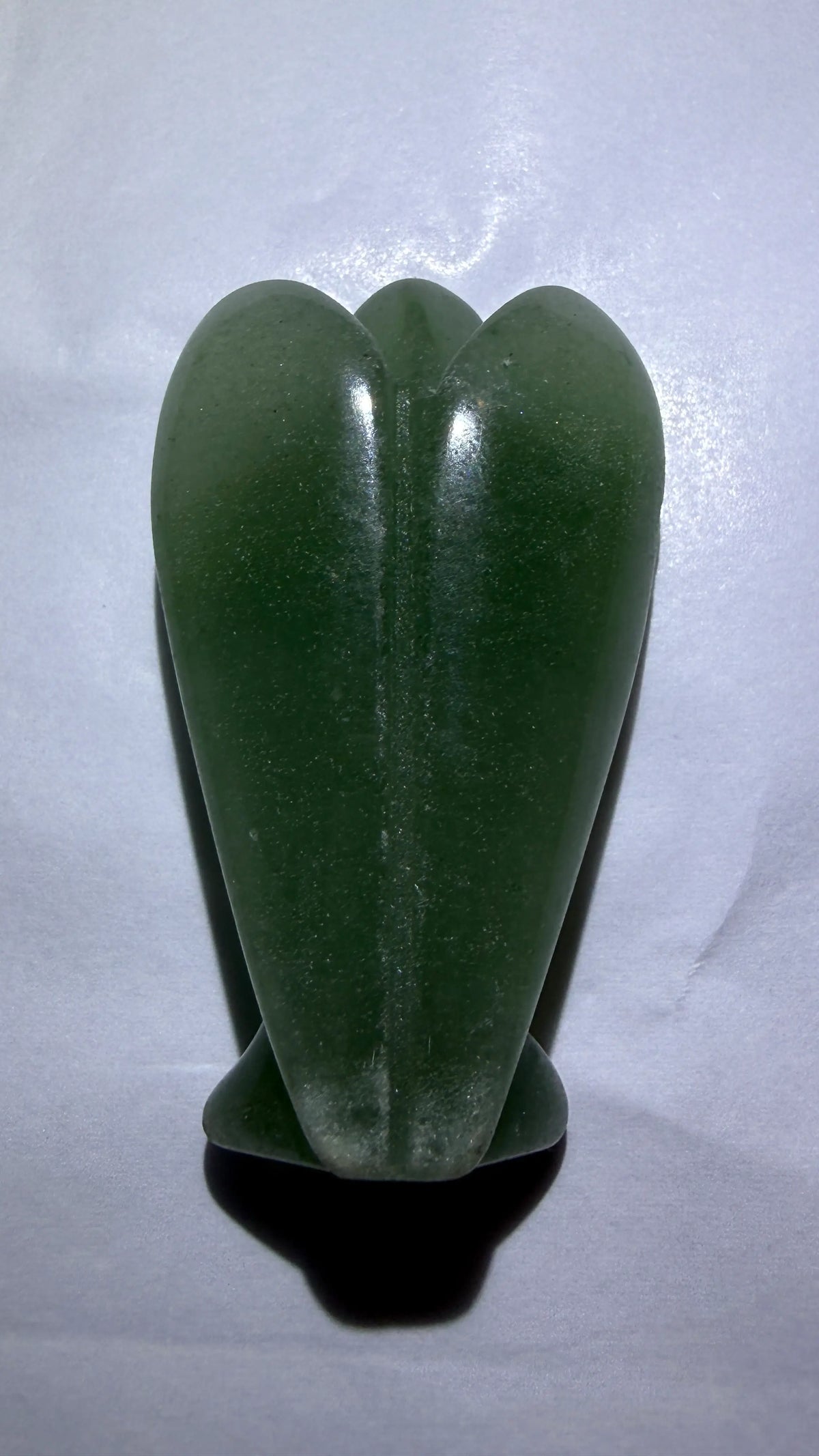 back of hand carved angel. green aventurine stone