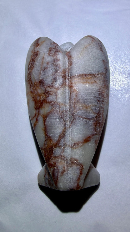 photo of back of red vein jasper hand carved angerl