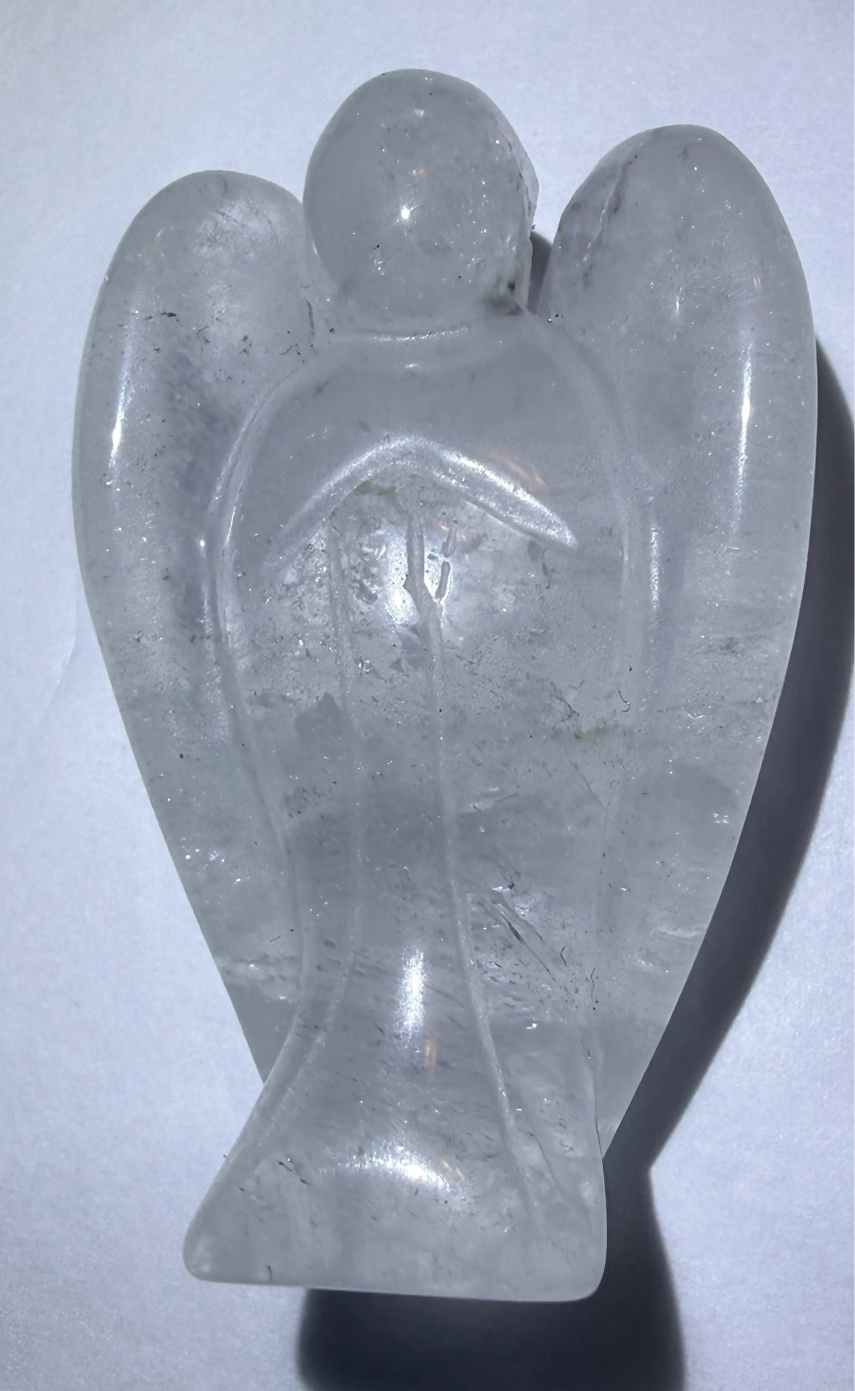 photo of clear quartz hand carved angel with rutile trapped inside (inclusion)