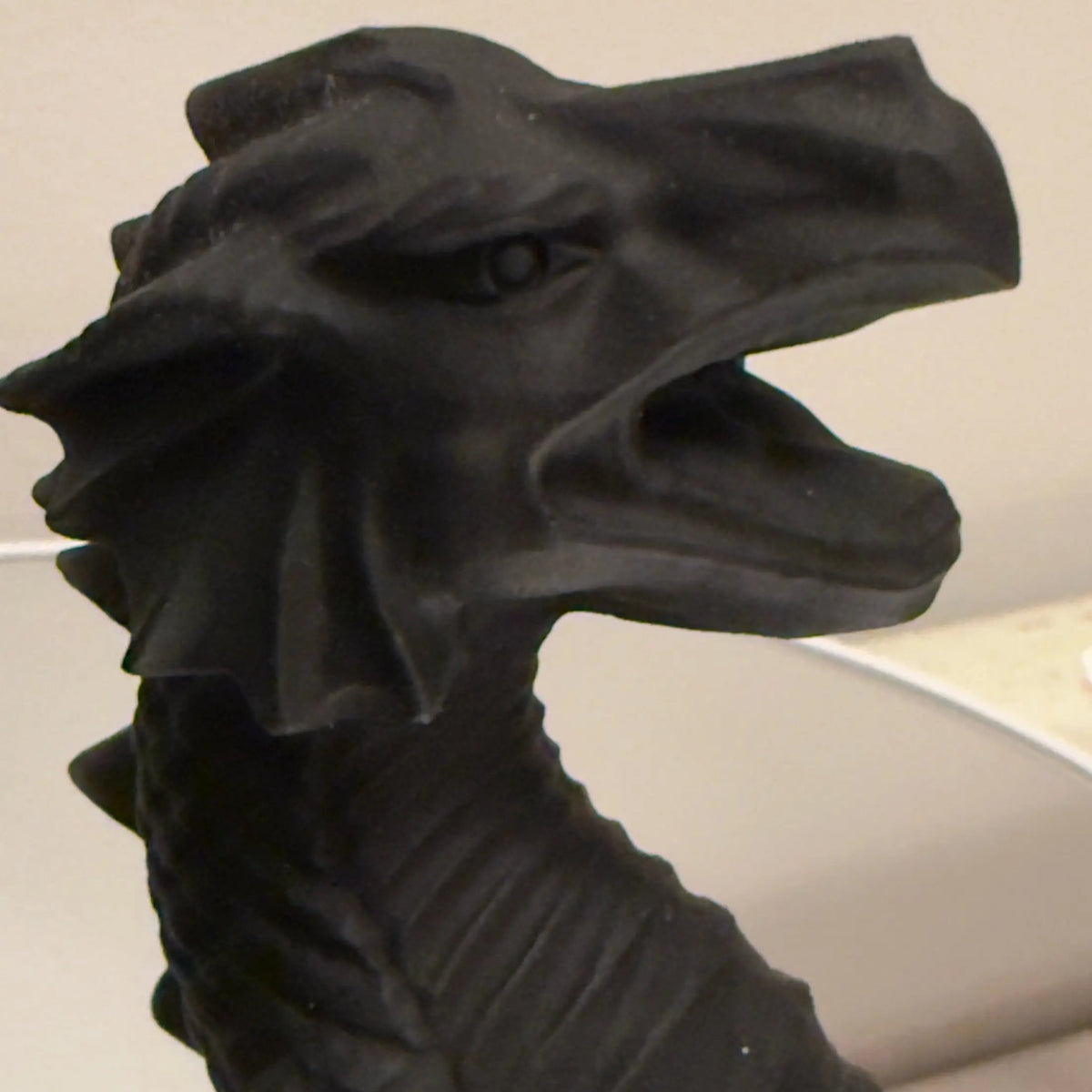 Black Obsidian dragon carving set close-up