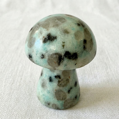 close up of kiwi jasper mushroom, hand carved figurine