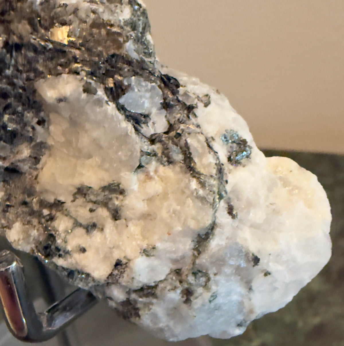 Rainbow Moonstone raw specimen with Tourmaline inclusions close-up