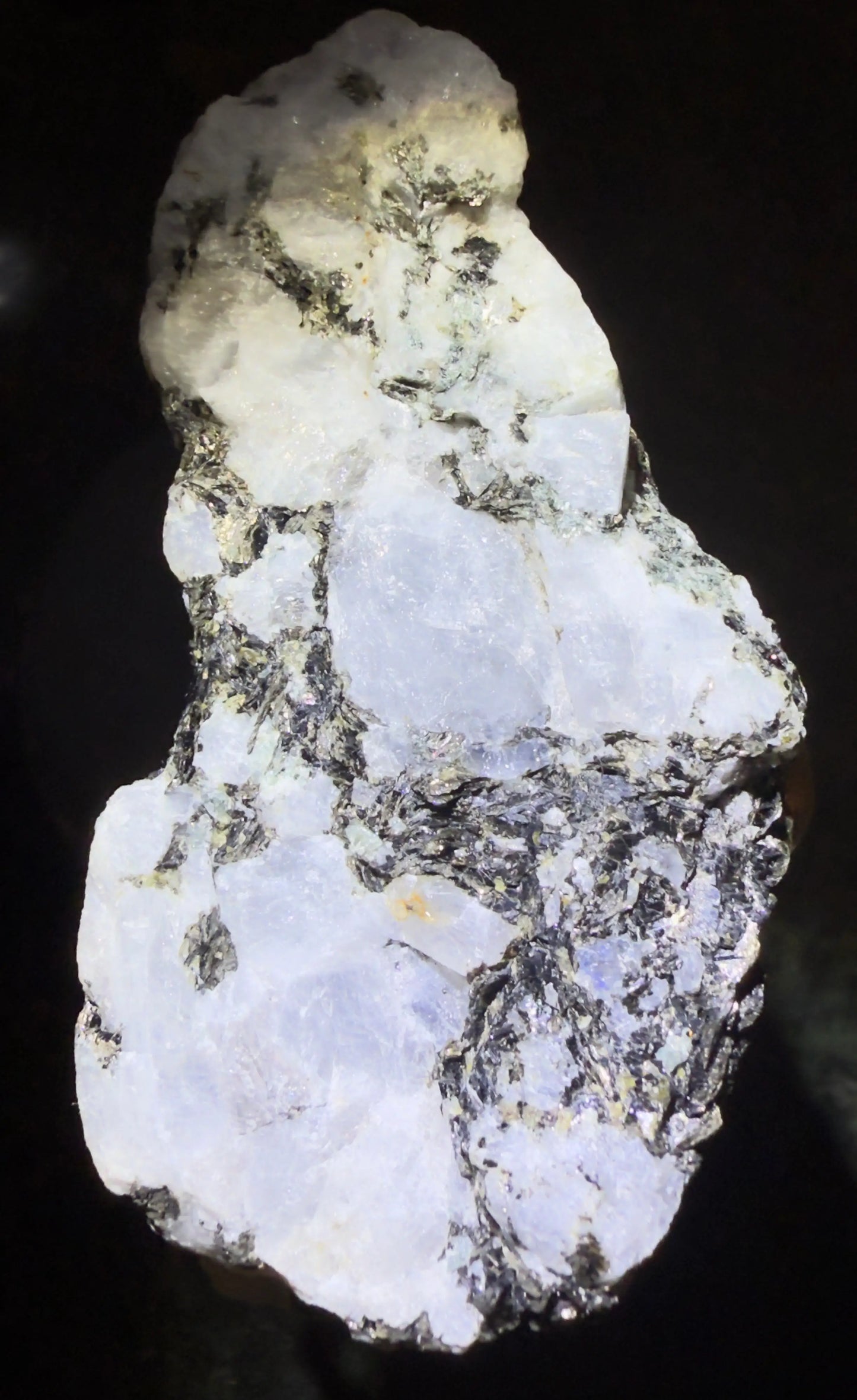 Rainbow Moonstone with Black and Blue Tourmaline Inclusions, a unique gemstone