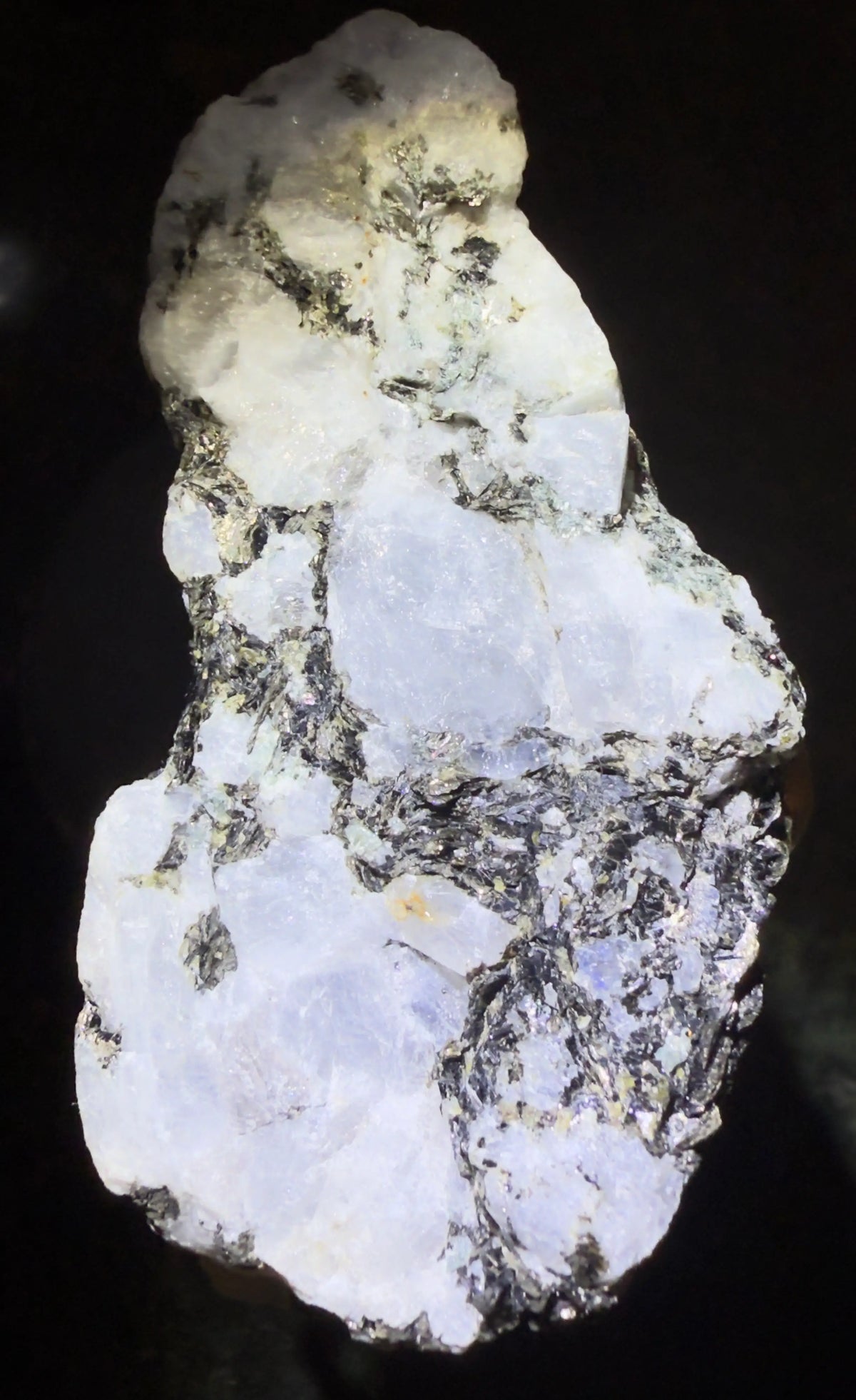 Rainbow Moonstone with Black and Blue Tourmaline Inclusions, a unique gemstone
