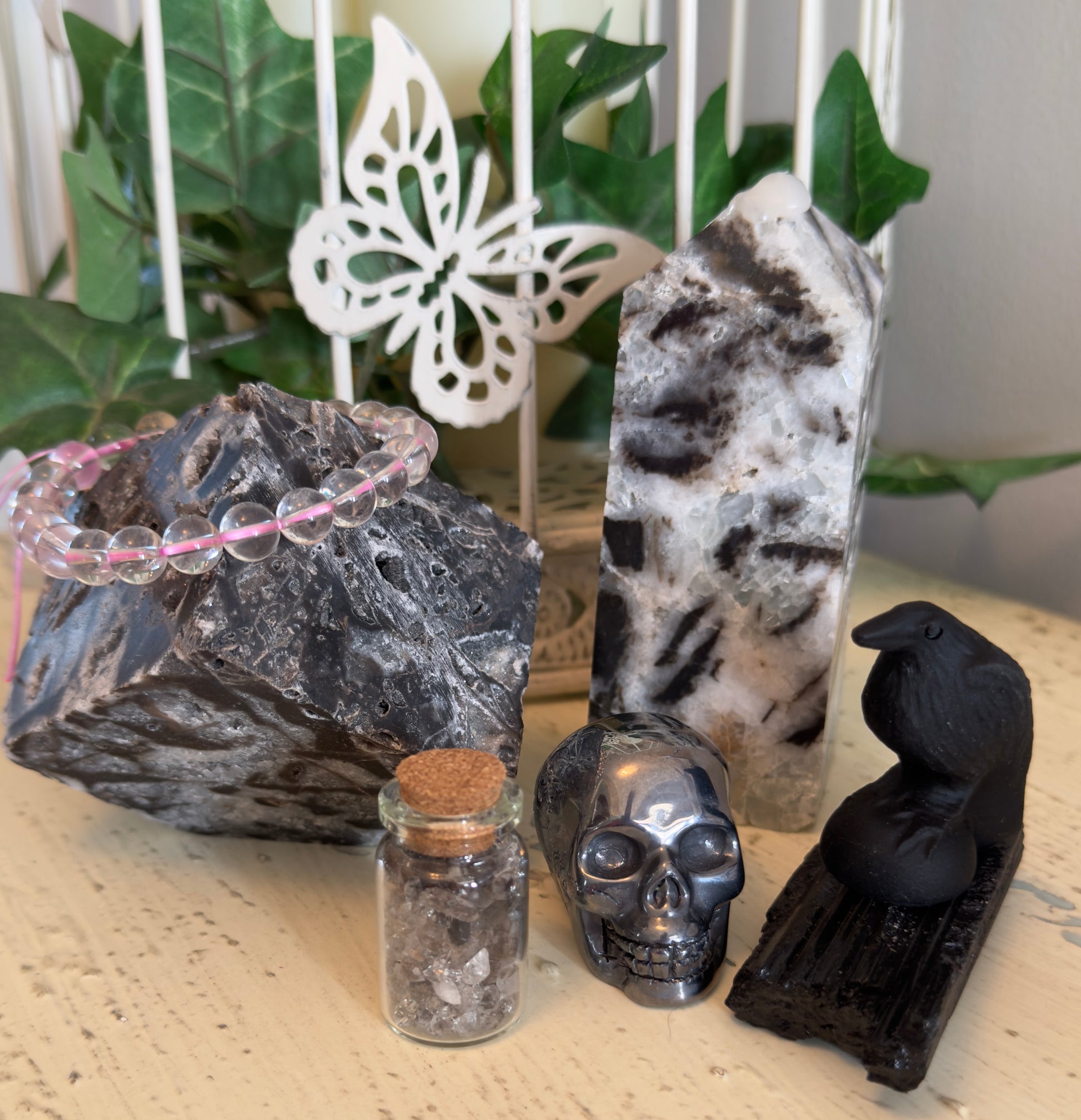 Set of crystals Sphalerite tower and cube beautiful rose quartz bead bracelet, hematite skull wish bottle one inch filled with herkimer diamonds large black tourmaline specimen carved black obsidian raven standing 