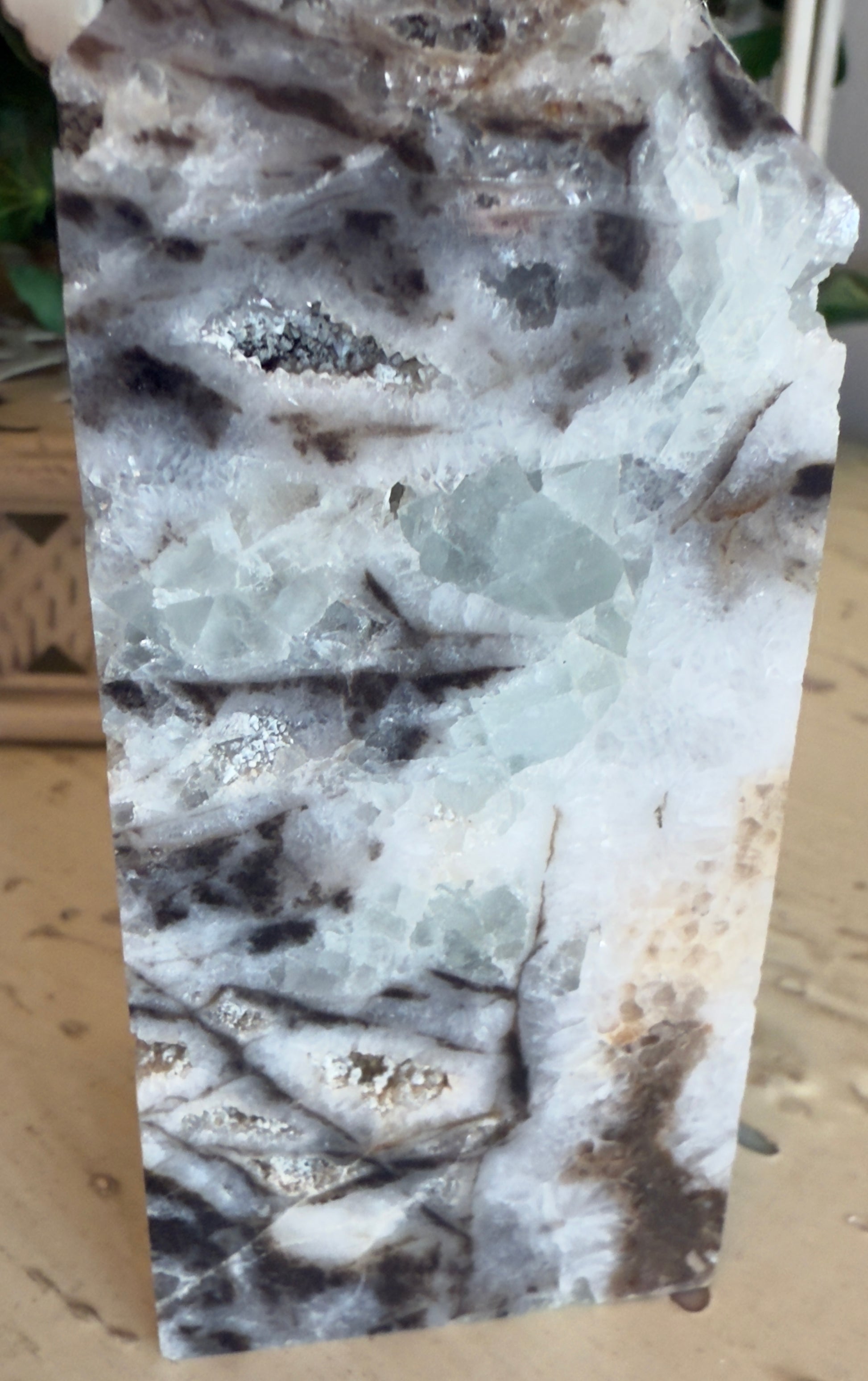 Close up of sphalerite tower white and black obsidian raven