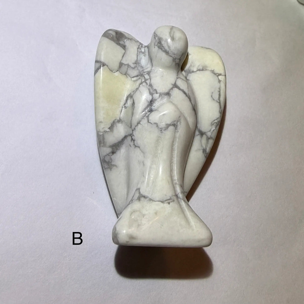side view photo of hand carved angel made from howlite angel b