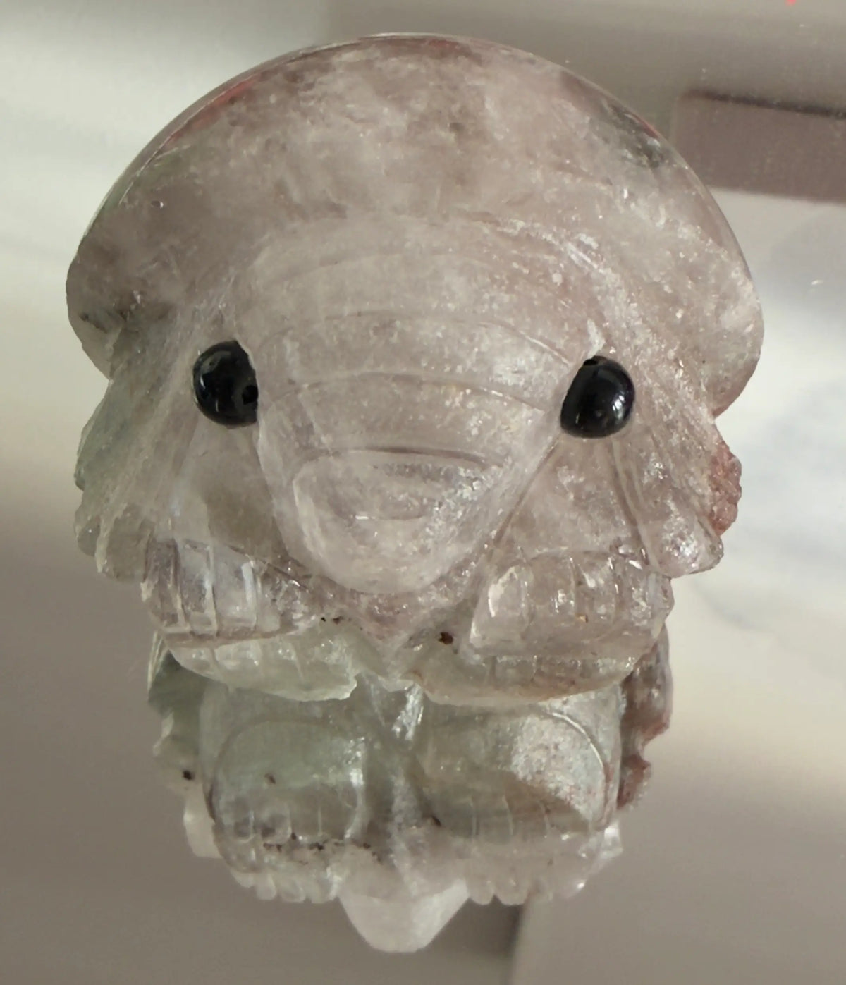 Close up of garden quartz carved elephant face