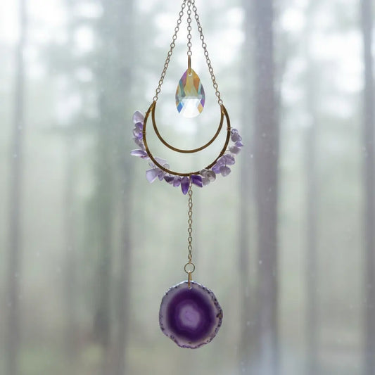 Amethyst suncatcher hanging in a window