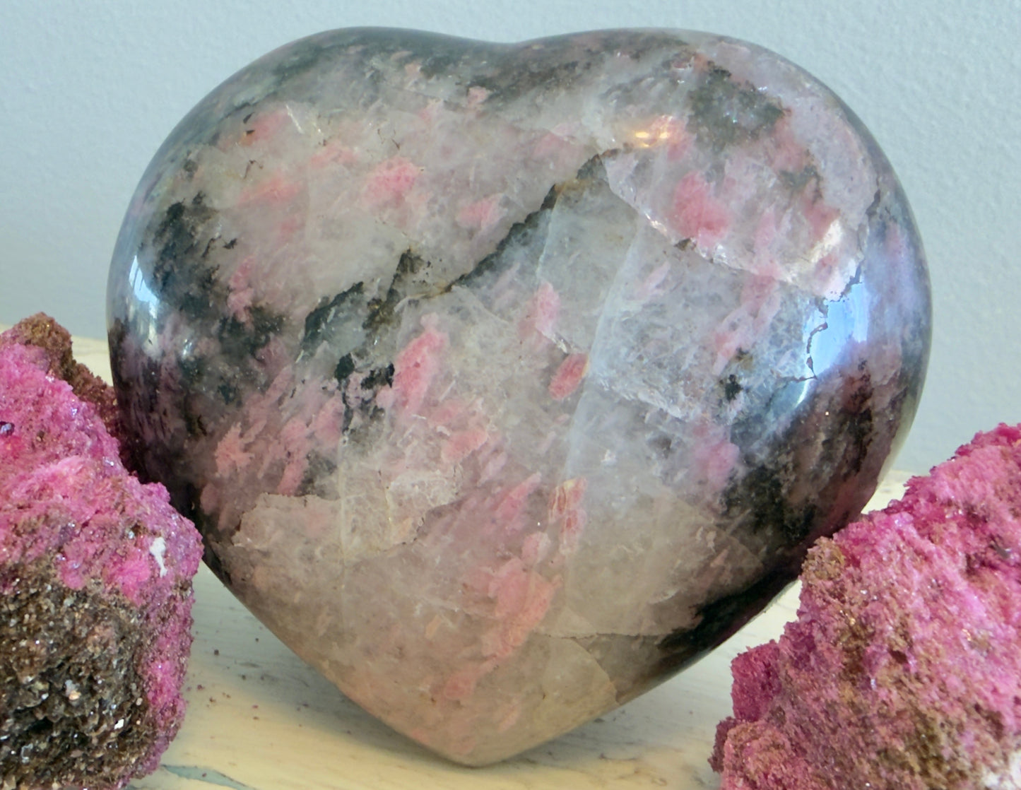 close up of extra large genuine rhodonite crystal heart 