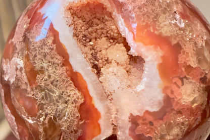 Close up of Carnelian Agate Sphere Druzy Pocket