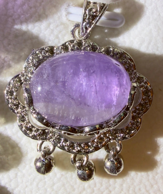 Amethyst Brooch on a table