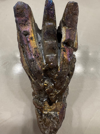 Iridescent bornite mineral with crystalline structure.
