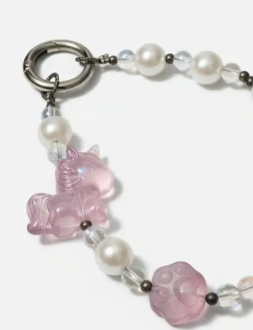 Pink unicorn charm on a pearl and crystal bracelet, a cute accessory