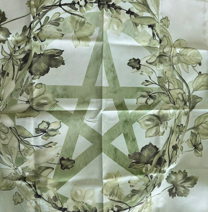 Silk scarf with a pentagram and floral design.