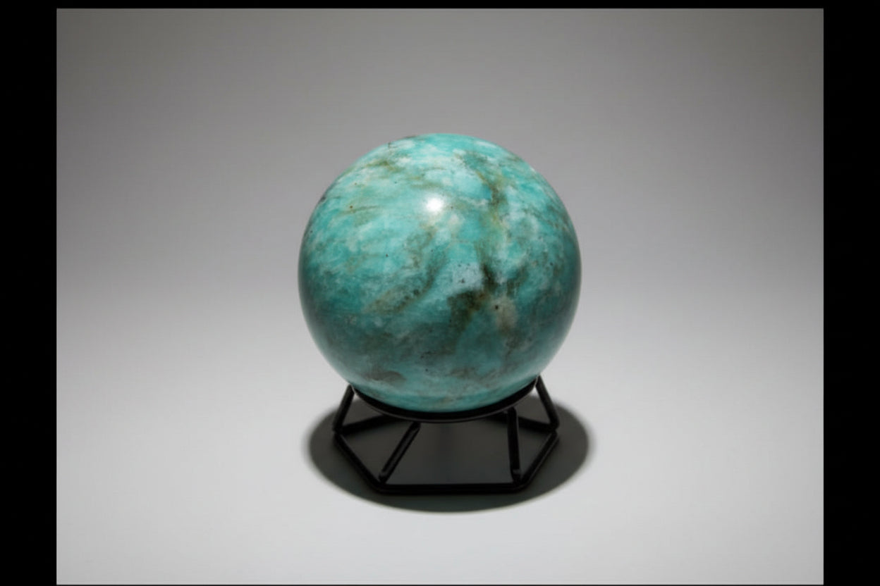 Amazonite Sphere colors teal, green, ivory sphere on a small stand with no background 