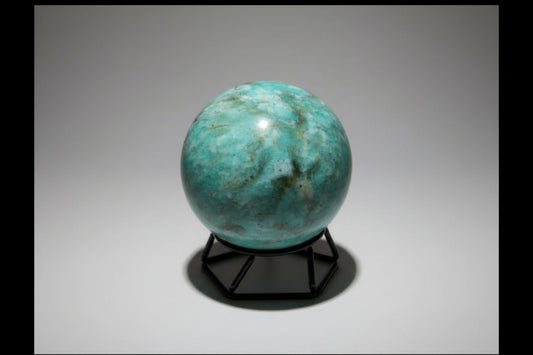 Amazonite Sphere colors teal, green, ivory sphere on a small stand with no background 