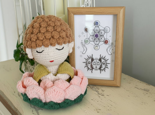 hand crafted crochet buddha in a lotus flower, framed chakra stones in a shadow box 