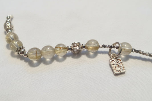 Petite Rutilated Quartz wealth bracelet with charm details