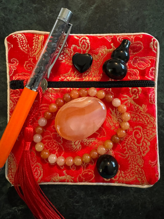 Carnelian meditation pouch set with bracelet stones and pen