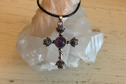 Black Roses and Amethyst Celtic style cross with a wax leather cord, on a beautiful rock 