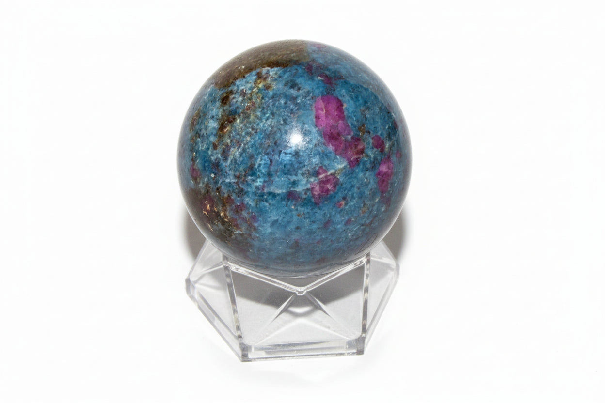 ruby in kyanite sphere on a small stand