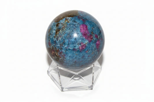 ruby in kyanite sphere on a small stand