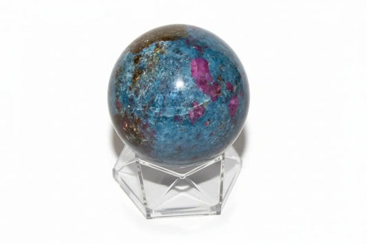 ruby in kyanite sphere on a small stand