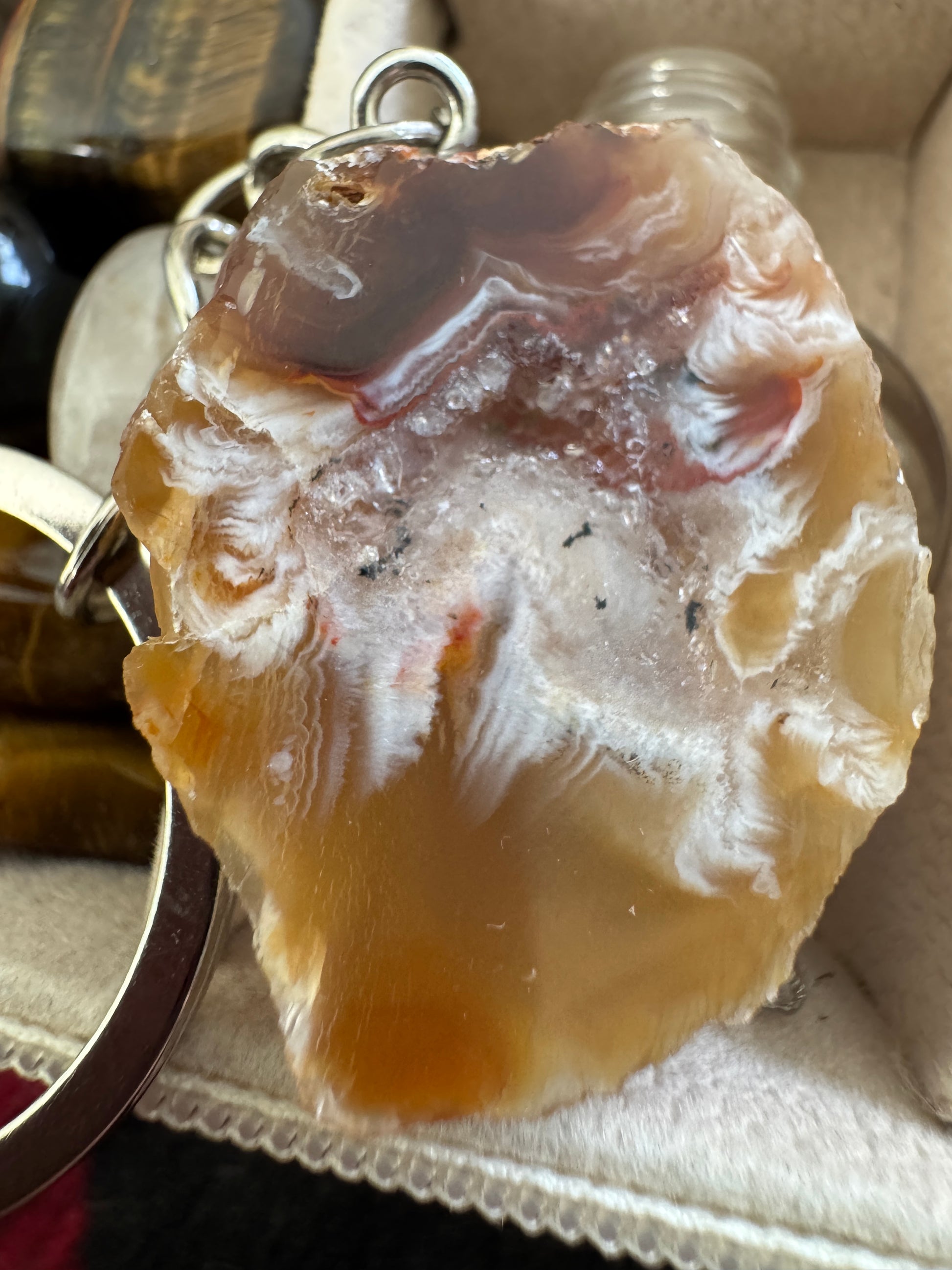 Polished agate pendant with silver keychain.