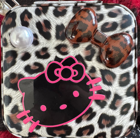 Leopard print box purse with Hello Kitty and bows.